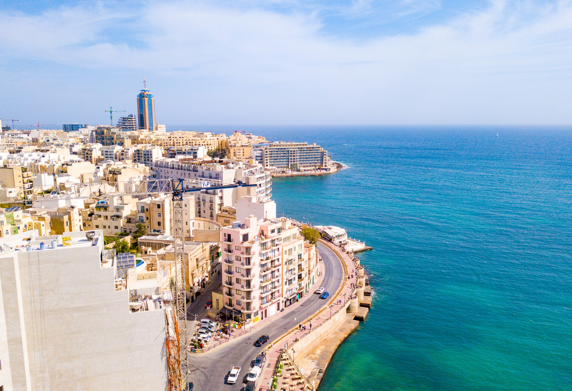 ST.JULIAN'S, MALTA, MAY 15, 2018 - Aerial view on the Spinola Bay with outside pool in St.Julian's from above - St.Julian's, Malta